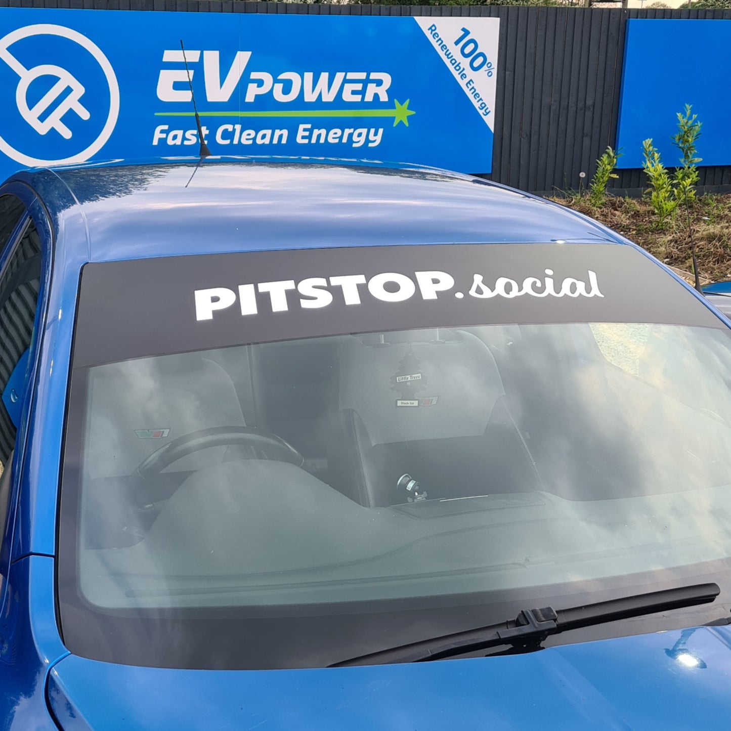 PITSTOP.Social Sunstrip White Text Black Background on Blue Skoda