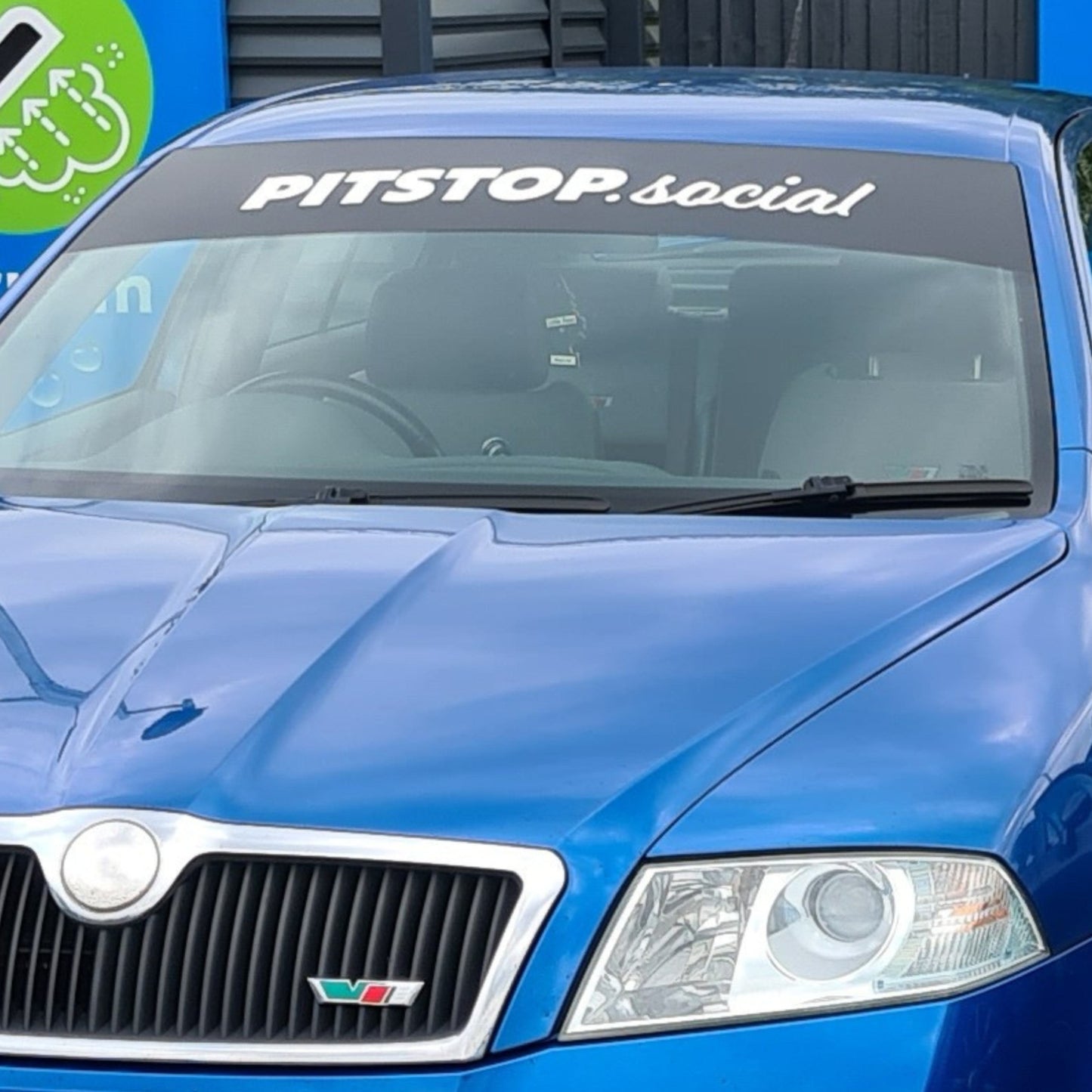 PITSTOP.Social Sunstrip White Text Black Background on Blue Skoda vrs