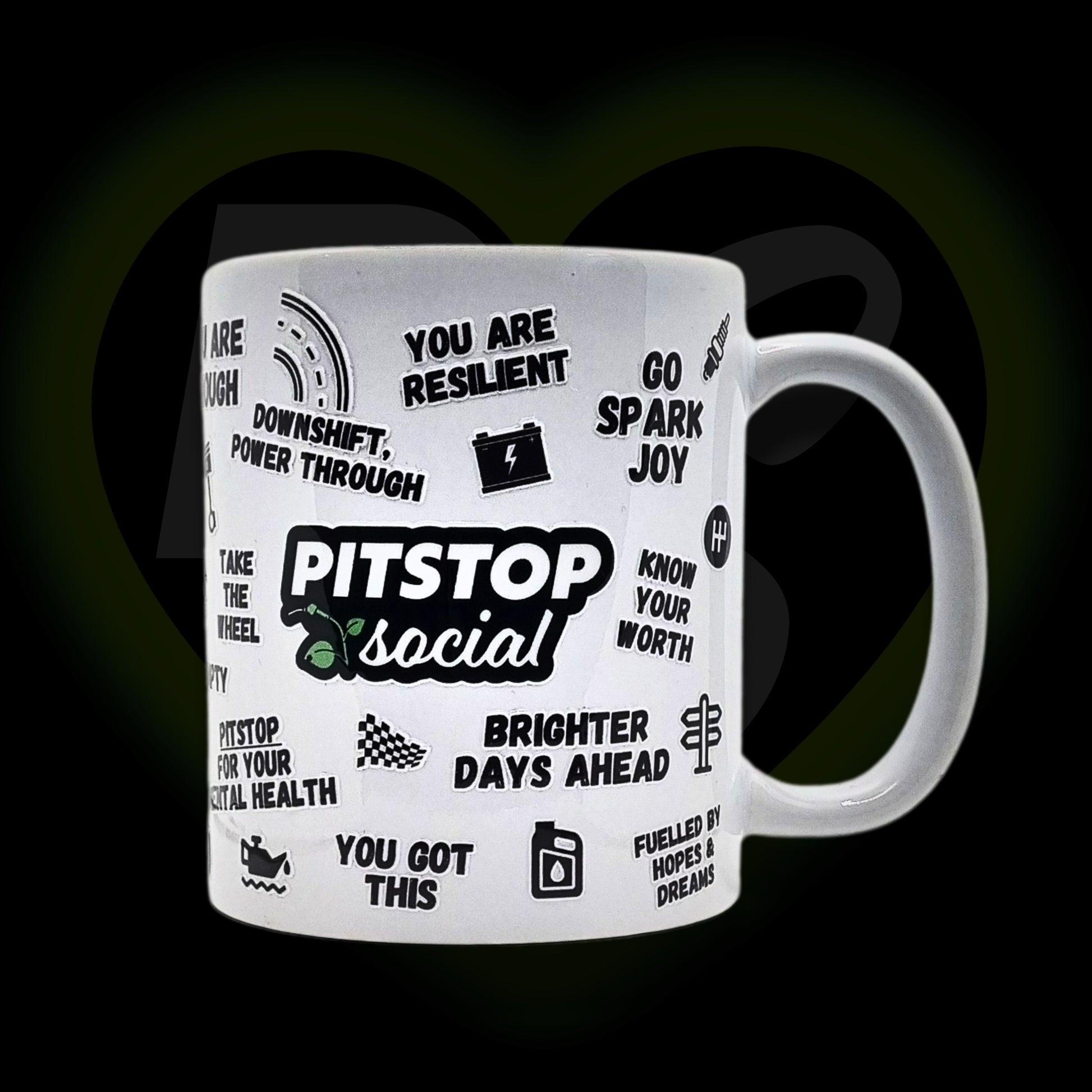 A white ceramic mug with 3D raised text and graphics including the Pitstop Social logo, various car engine warning symbols form mental health
