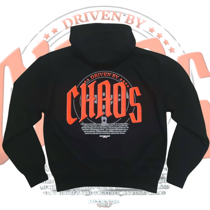 A black oversized box-fit premium hoodie with 'DRIVEN BY CHAOS' printed in large red letters within a car steering wheel on the back.