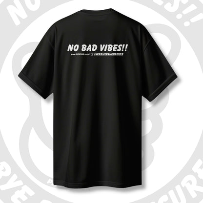 Black t-shirt with 'NO BAD VIBES!!' and japanese text on the back against a light grey artistic background.