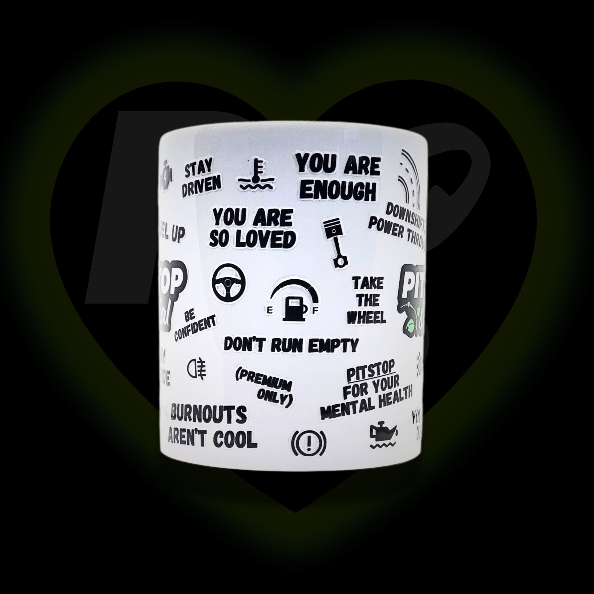 A white ceramic mug with 3D raised text and graphics including the Pitstop Social logo, various symbols and automotive phrases