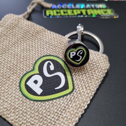 PITSTOP.Social logo green heart on a solid metal piston key chain fidget 