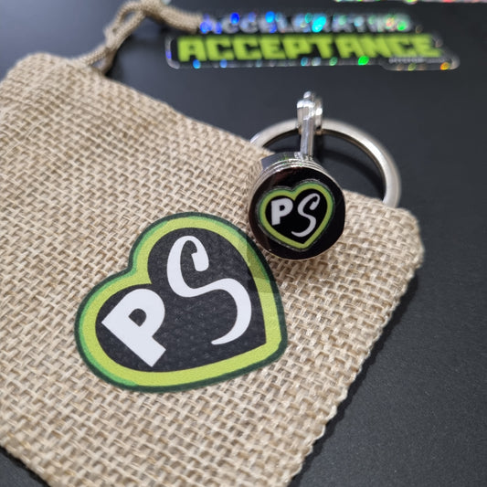 PITSTOP.Social logo green heart on a solid metal piston key chain fidget 