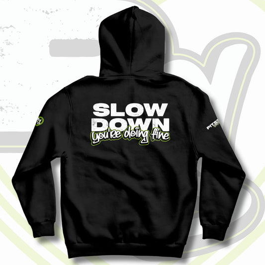 Black hoodie with the text 'SLOW DOWN You're doing fine' printed on the back in graffiti text with green outline